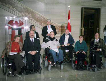 a group of people in front of a stairway.